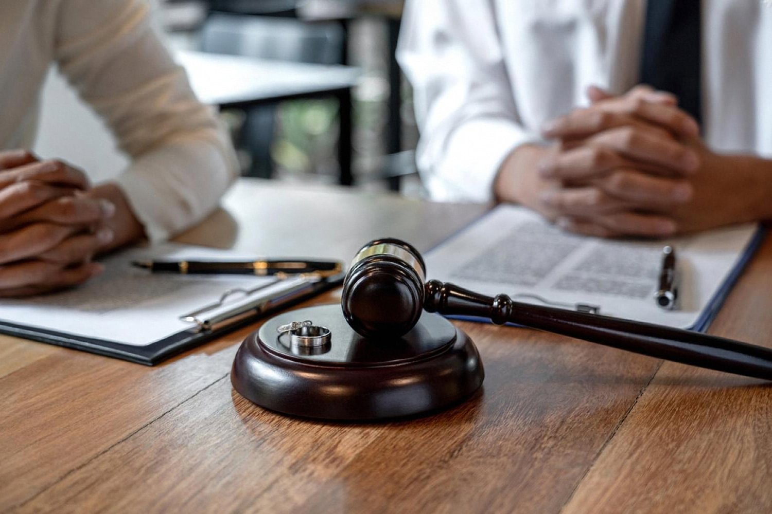 Lawyer and client discussing WhatsApp chat evidence in a UAE commercial dispute meeting